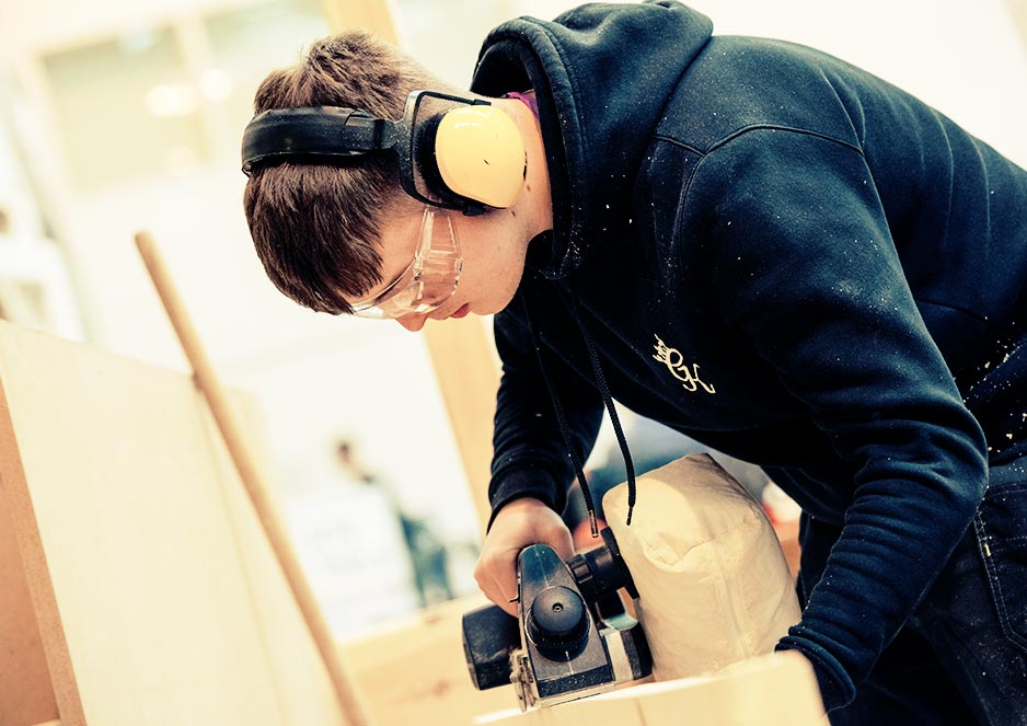 Carpenters work on practical projects to get them ready for the world of work.