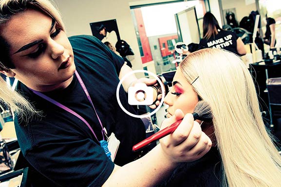 Beauty students practice on one another to ready themselves for working with real clients in the salon environment.